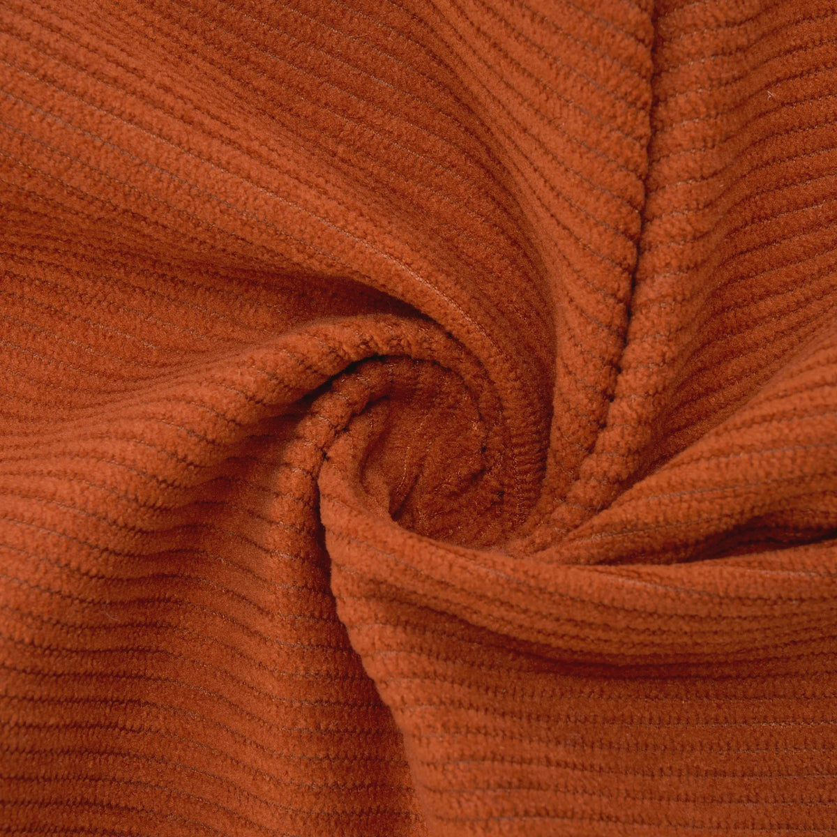 Orange corduroy upholstery fabric close-up with ribbed texture