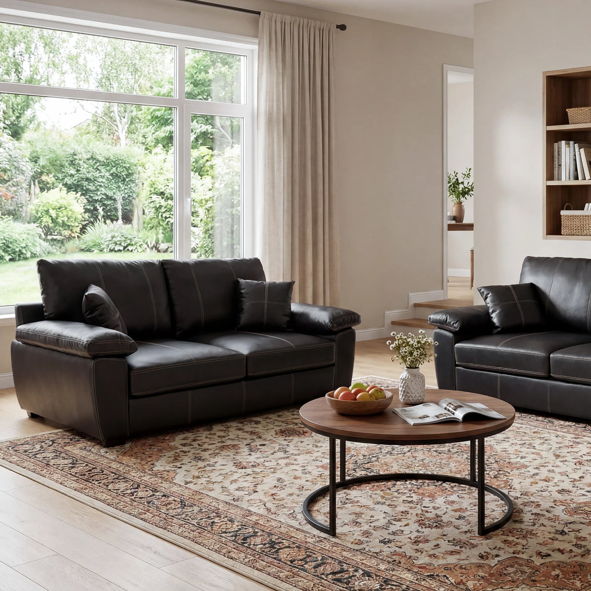Black leather-look loveseat with tufted back and deep seat cushions