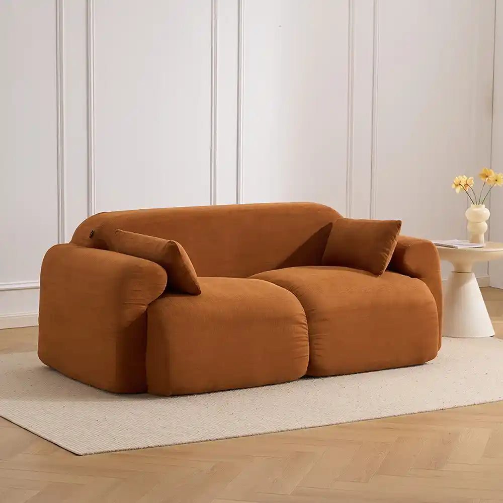 Brown corduroy loveseat sofa with rounded arms and deep seat cushions