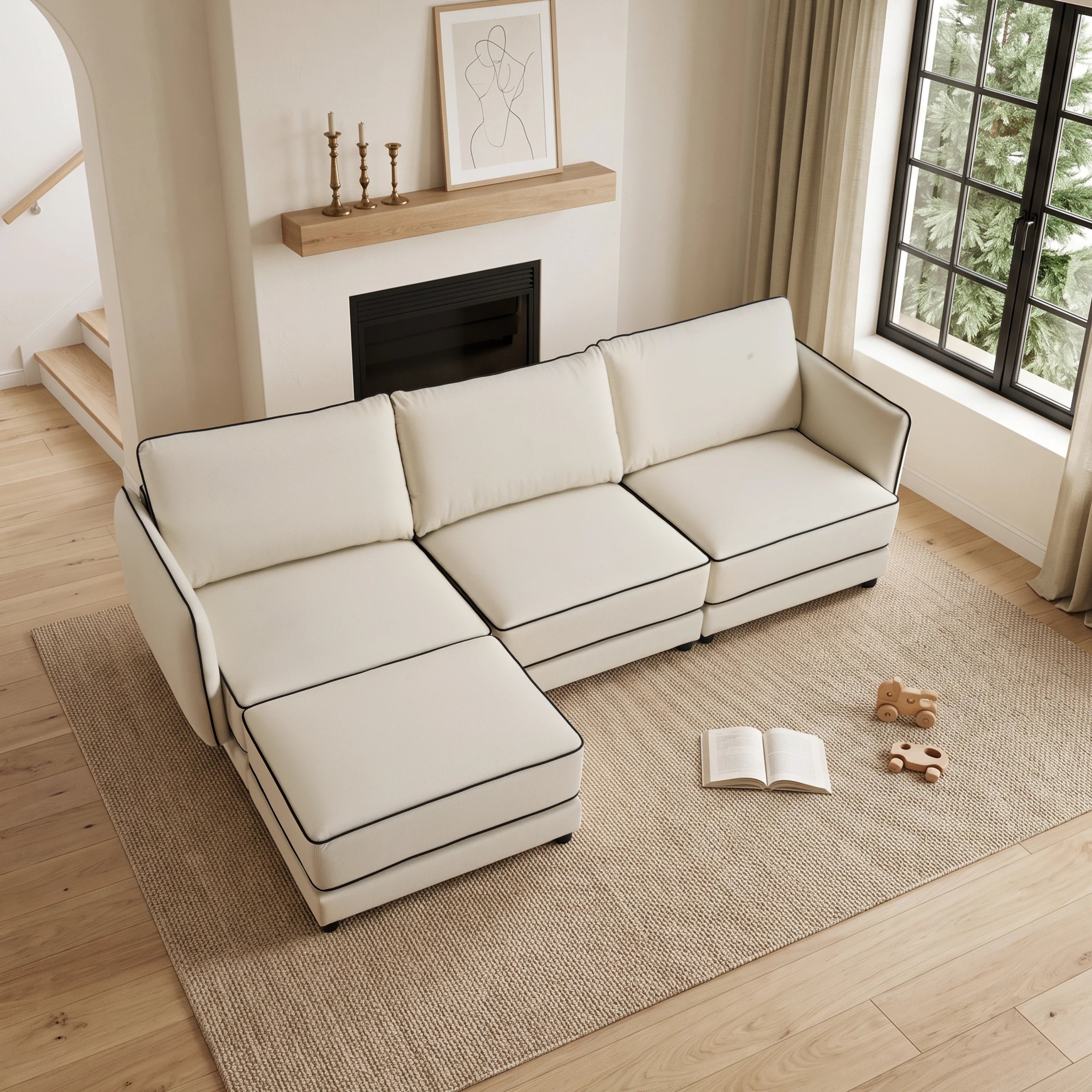 Cream sectional sofa with chaise ottoman, piped trim, and three back cushions