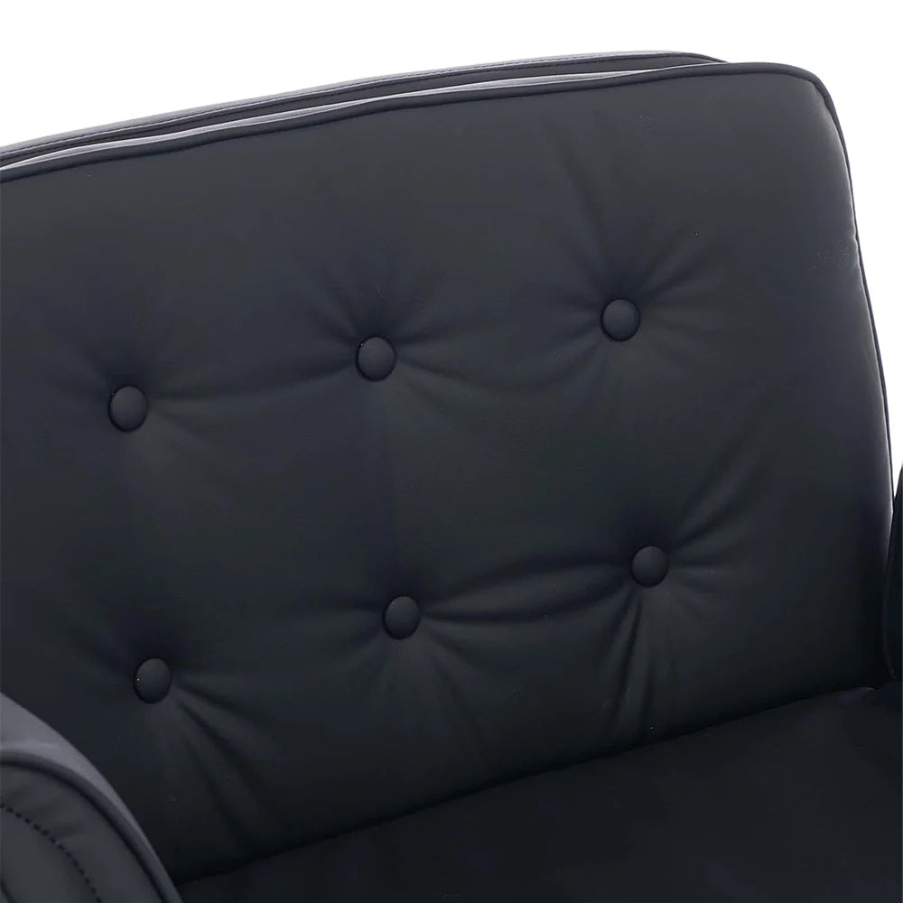Dark upholstered chair backrest with tufted button detailing
