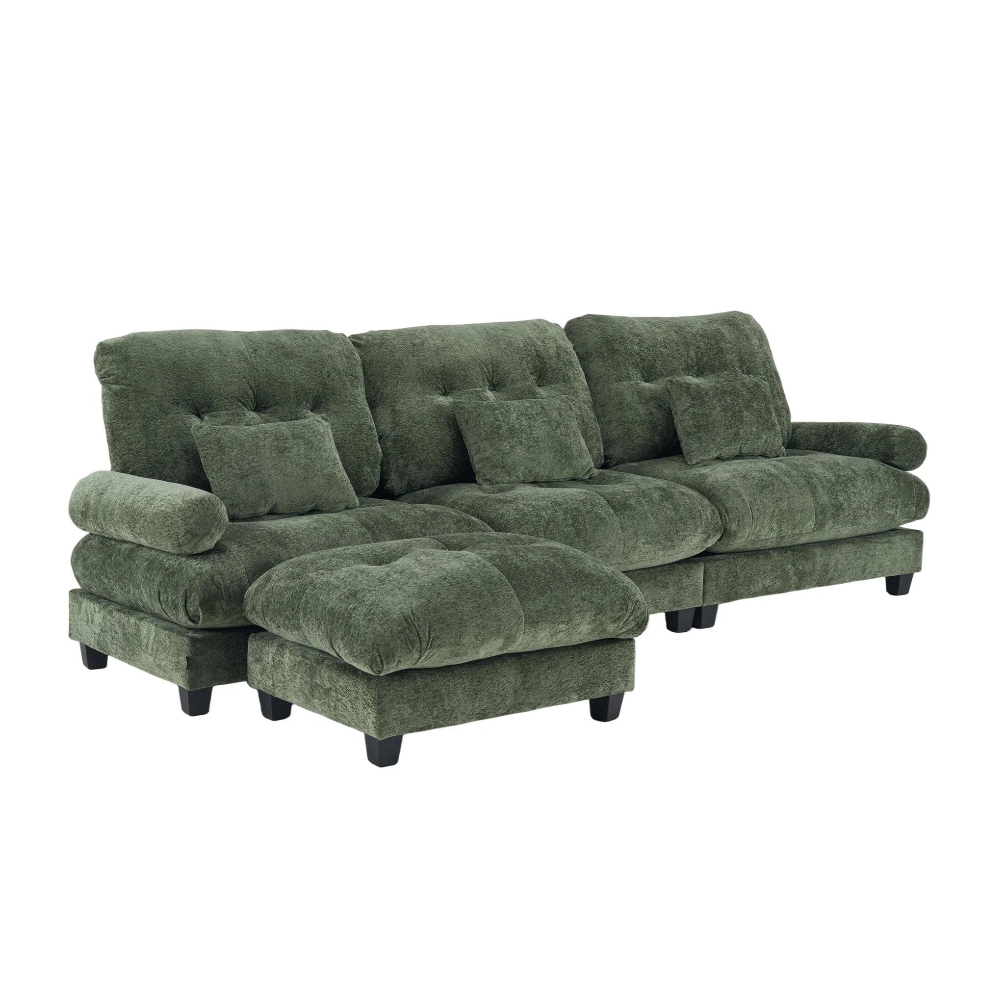 Green plush sofa with tufted cushions, chaise-style seat, and dark wooden legs.