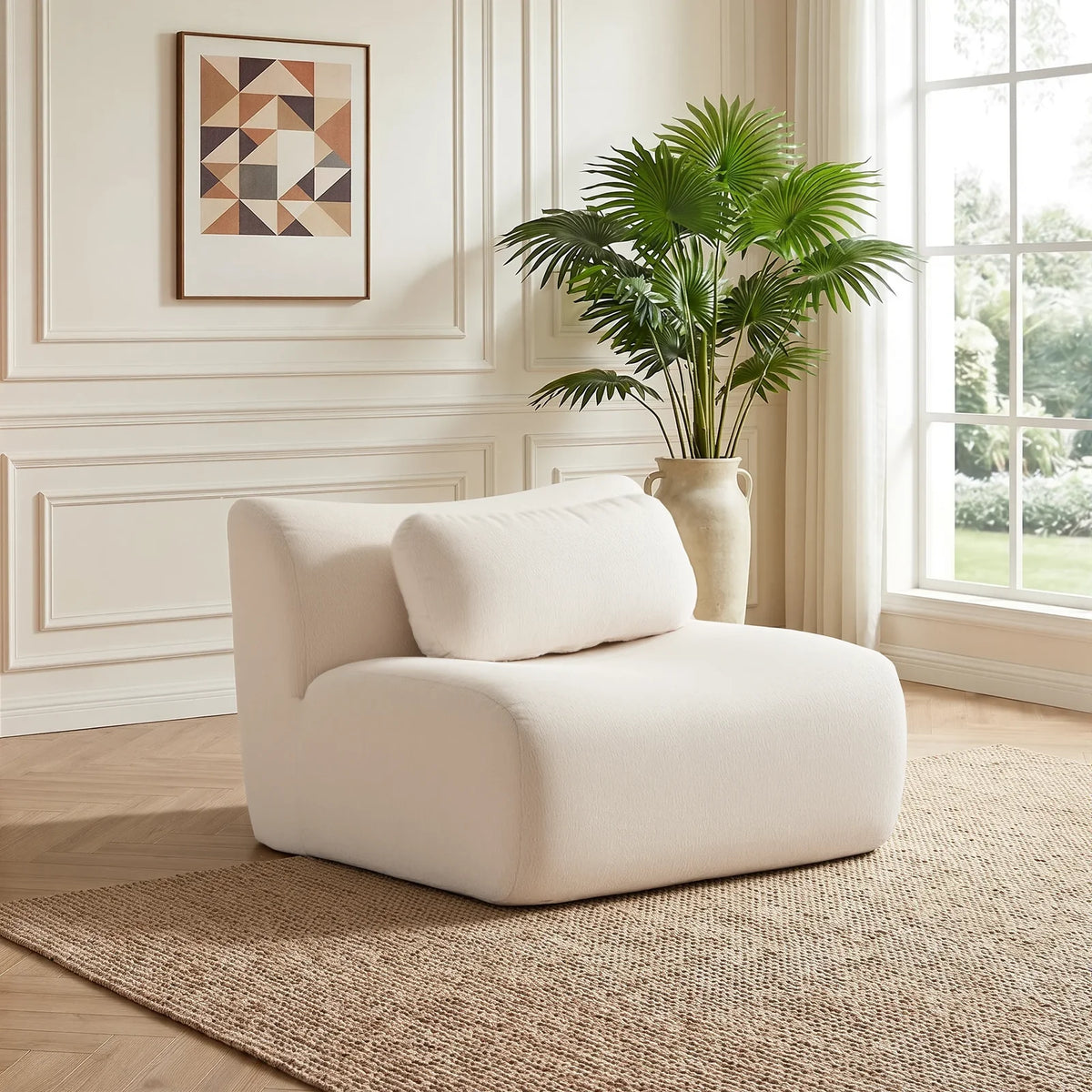 White modular compressed sofa in angled view with rounded arms and two pillows