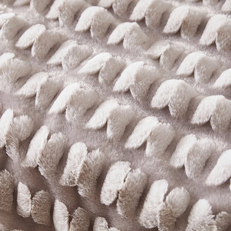 Plush textured throw blanket fabric in taupe with raised knotted pattern