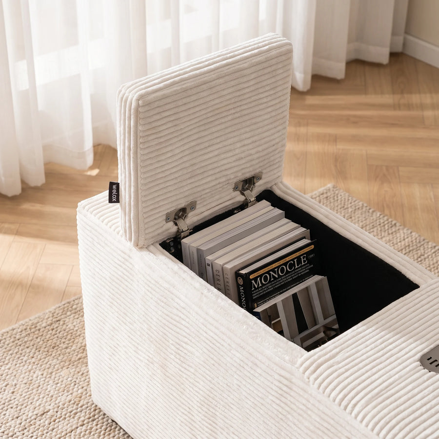 Cream textured ottoman with open top compartment showing stacked books