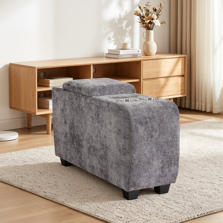Grey upholstered storage side table ottoman with cup holder recess and speaker panel