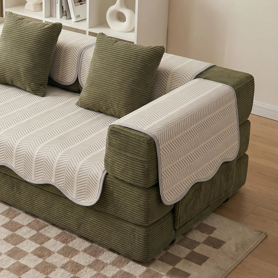 Sofa pad set close-up: cream seat cover with green arm pad and textured chevrons