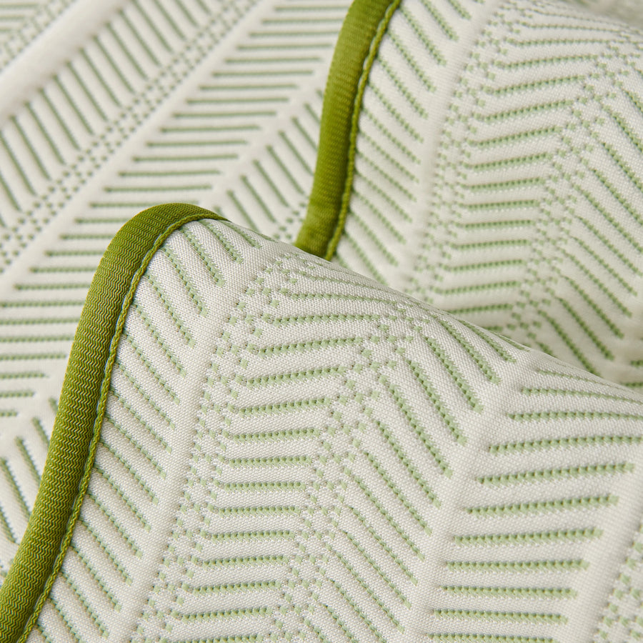 Sofa pad set fabric close-up: white cover with green zigzag pattern and green trim