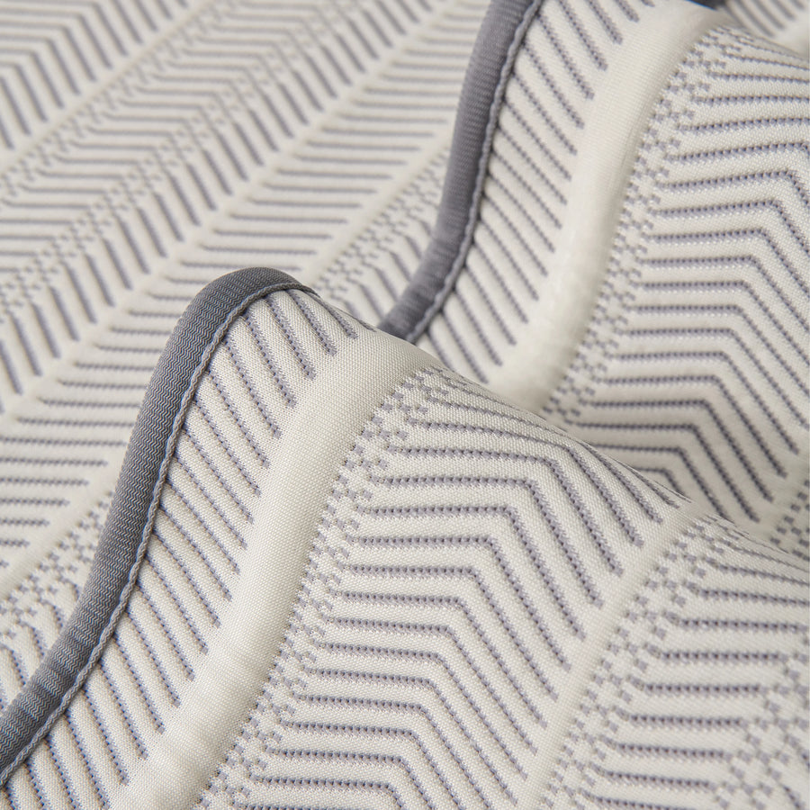 Sofa pad set fabric close-up: white zigzag pattern with dark gray trim and piping
