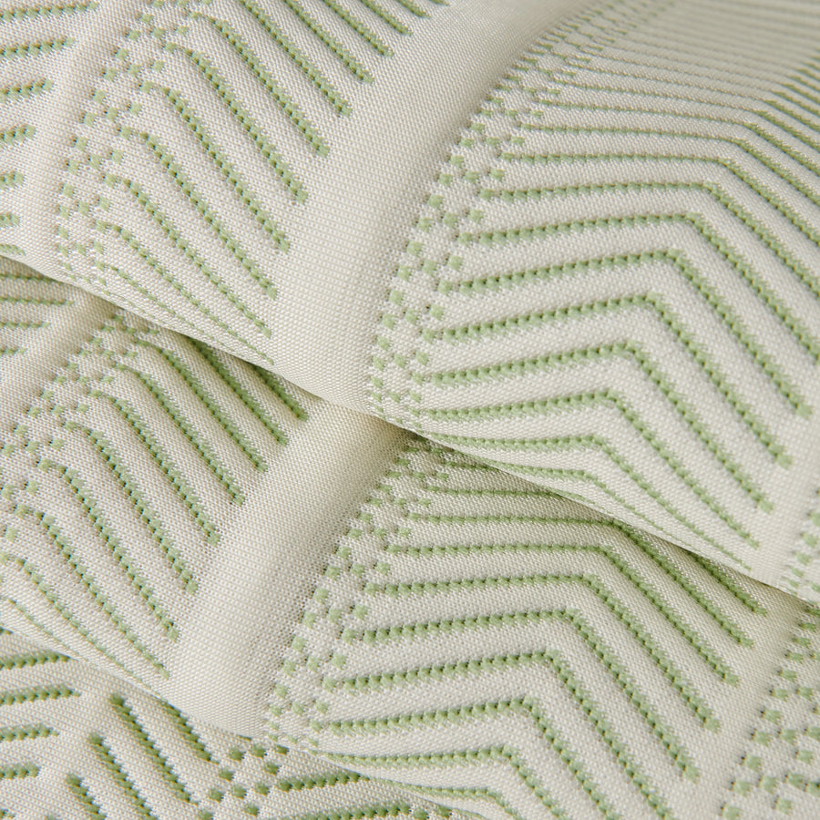 Sofa pad set fabric close-up: off-white cover with green zigzag embroidery lines