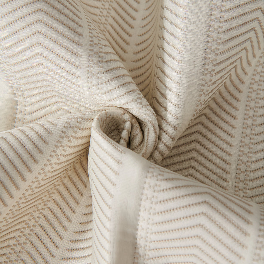 Sofa pad set fabric close-up: cream cover with tan zigzag lines, folded over itself