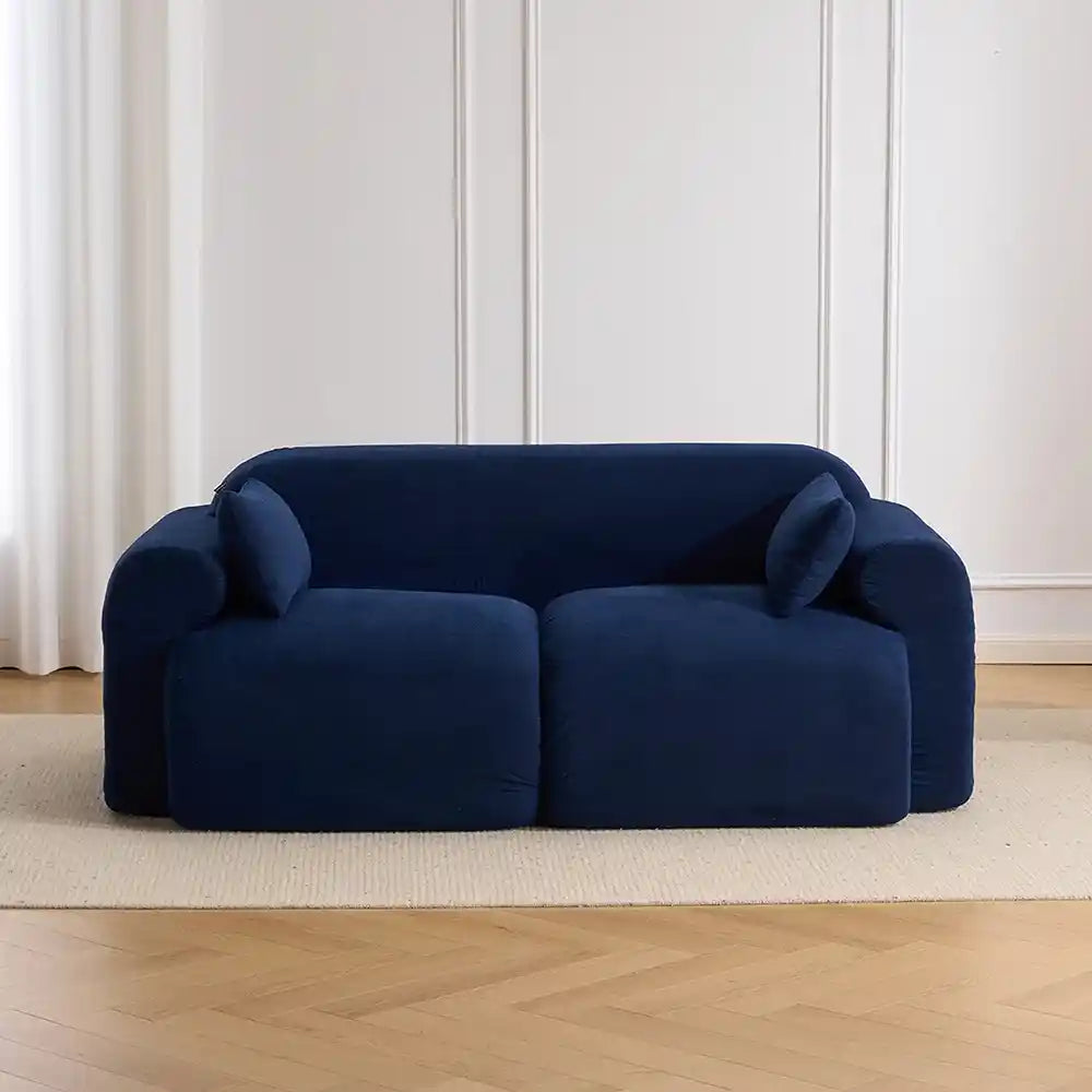 Dark blue ribbed corduroy loveseat sofa with rolled arms and deep seat cushions
