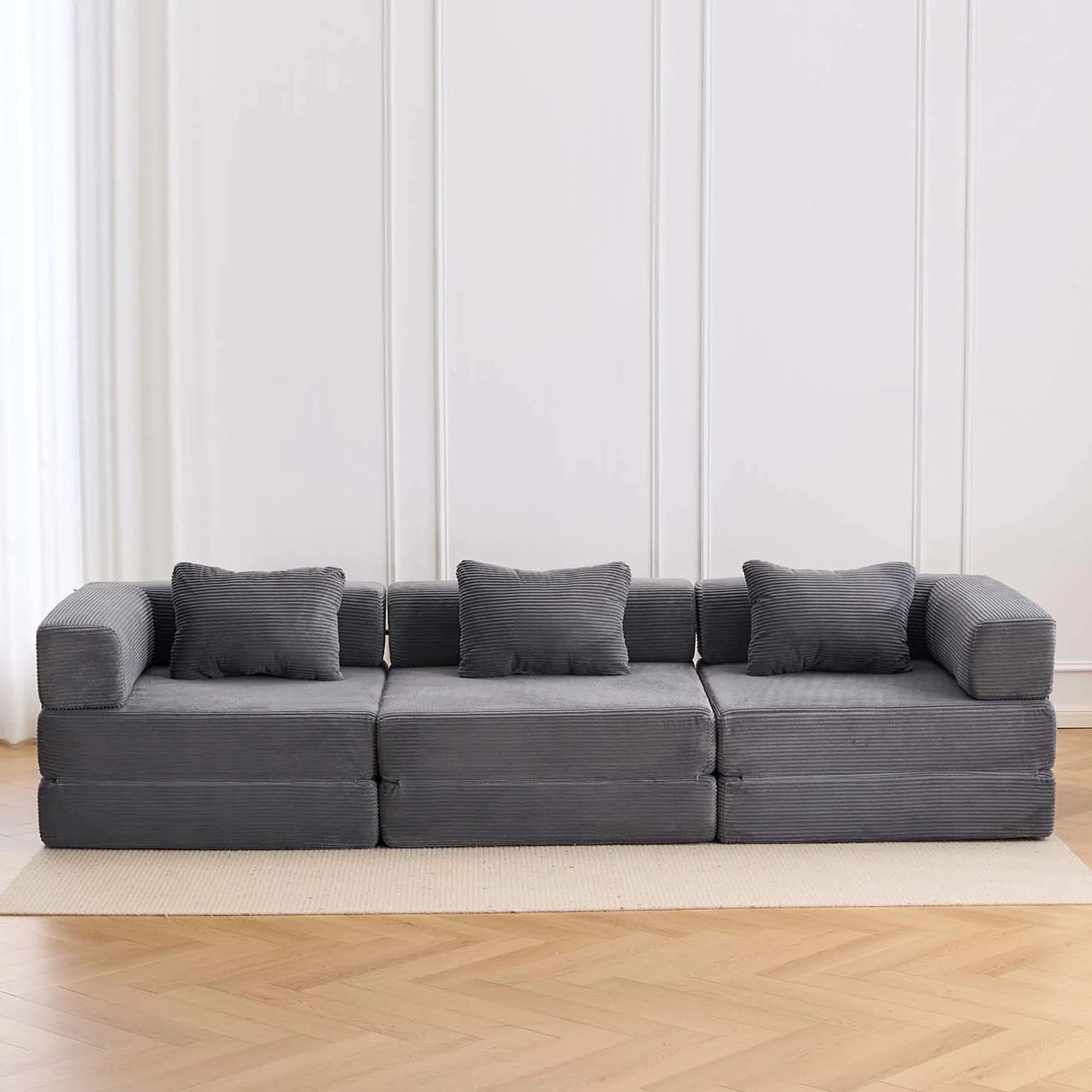 Dark gray corduroy three-seat modular sofa with seat and back cushions