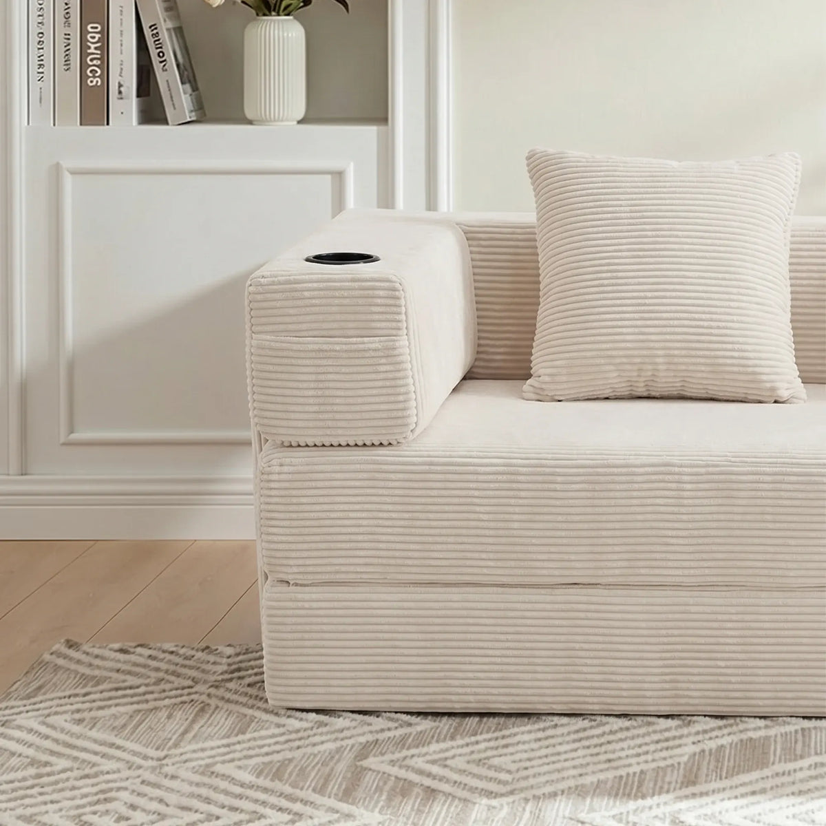 Cream modular sofa arm storage compartment with black handle and cushioned backrest