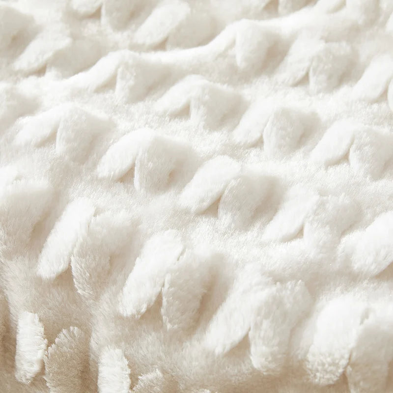 Cream plush blanket fabric with raised, bubble-like texture