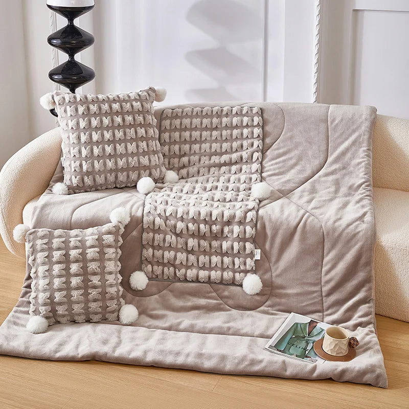Plush throw pillow with hidden blanket, taupe woven cover with pom-pom edges