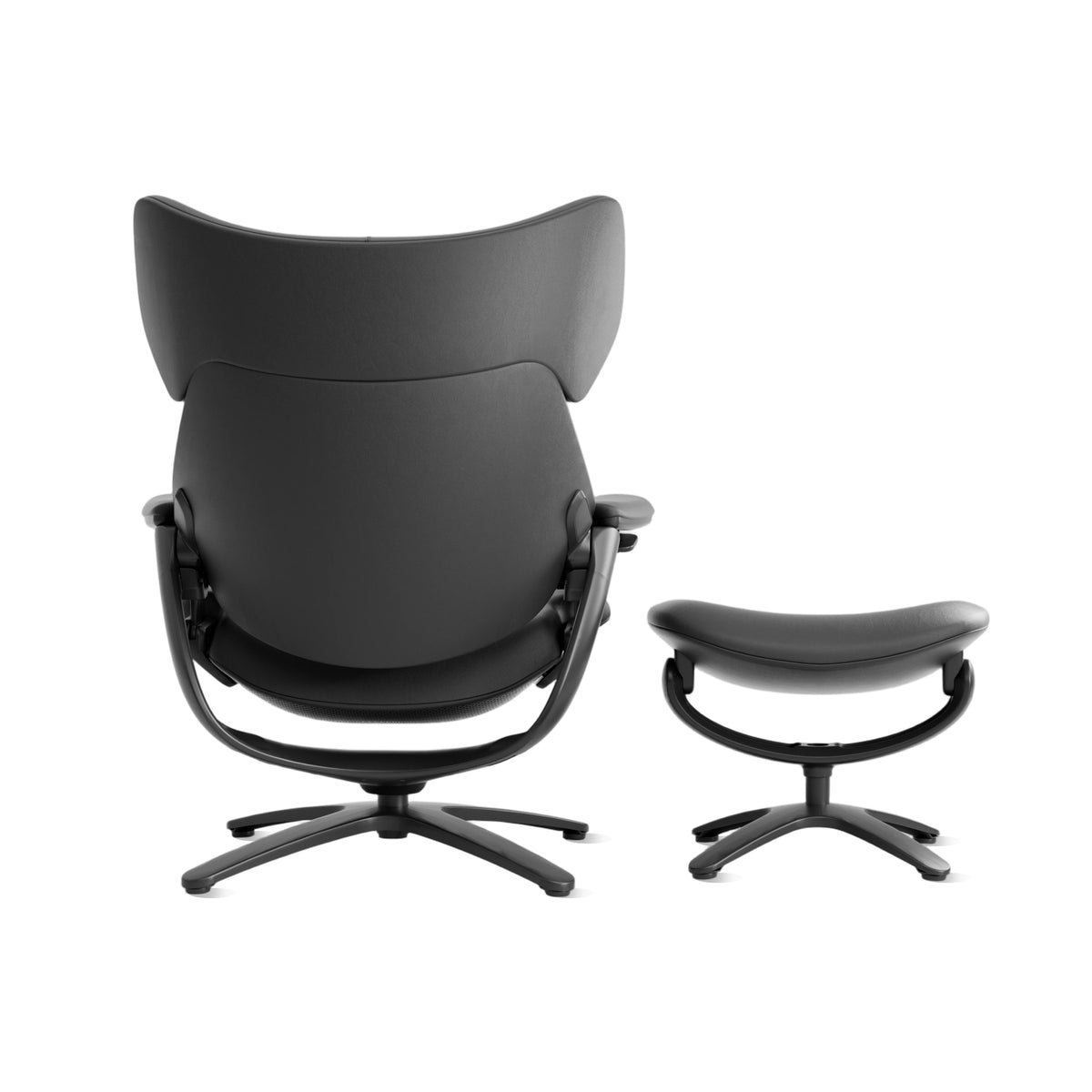 Black recliner lounge chair from the back, with matching ottoman on swivel base.