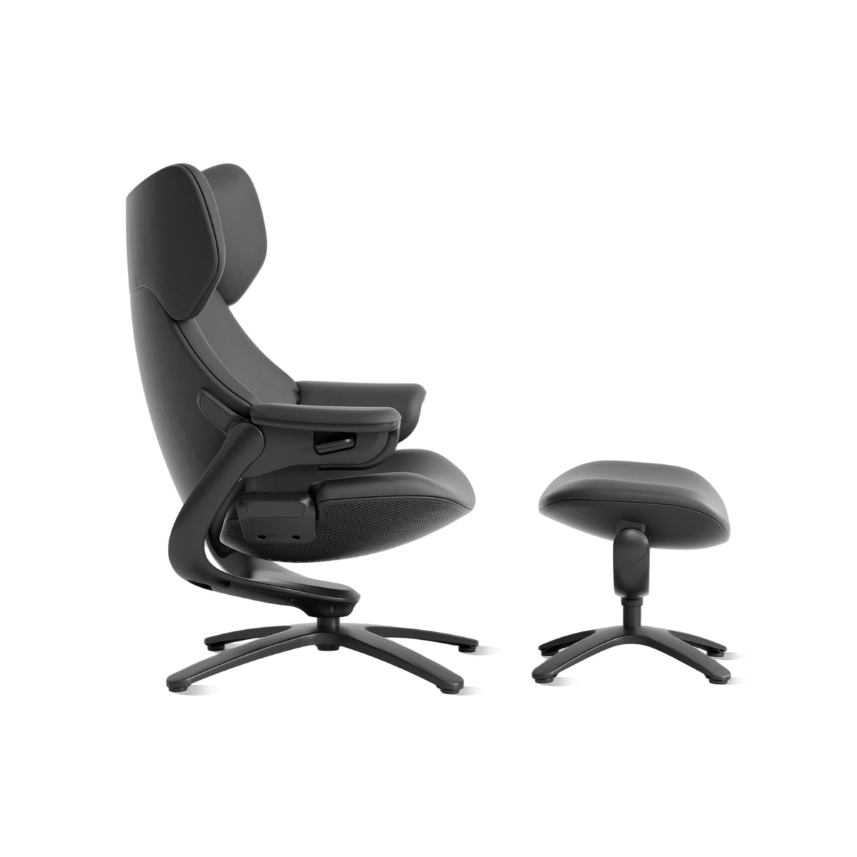 Black recliner chair with curved ottoman, side view showing adjustable armrest panel.