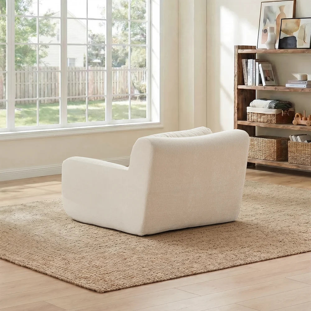 White modular compressed sofa with rounded arms and a back cushion with lumbar pillow