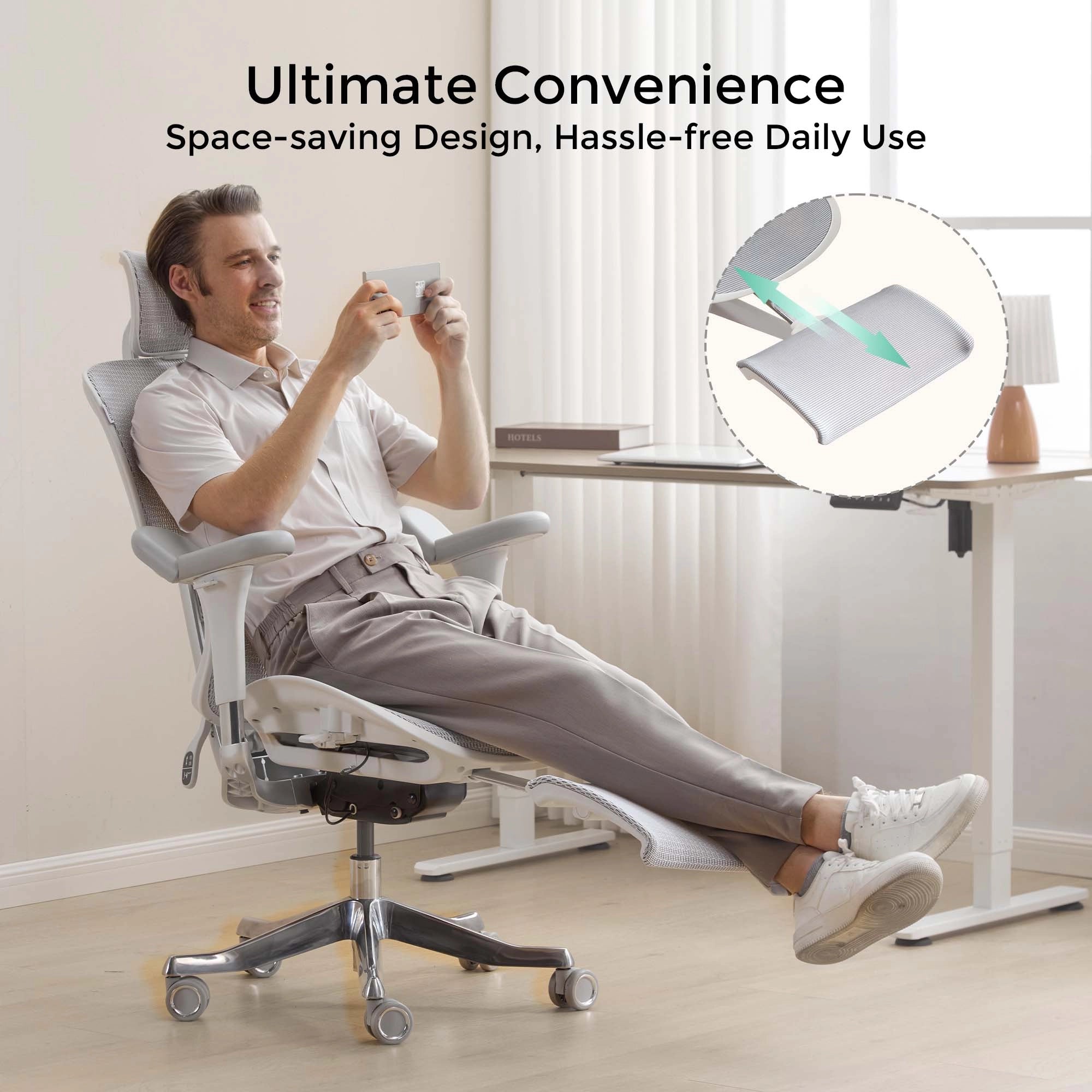 White ergonomic office chair reclined with adjustable leg rest and mesh back.